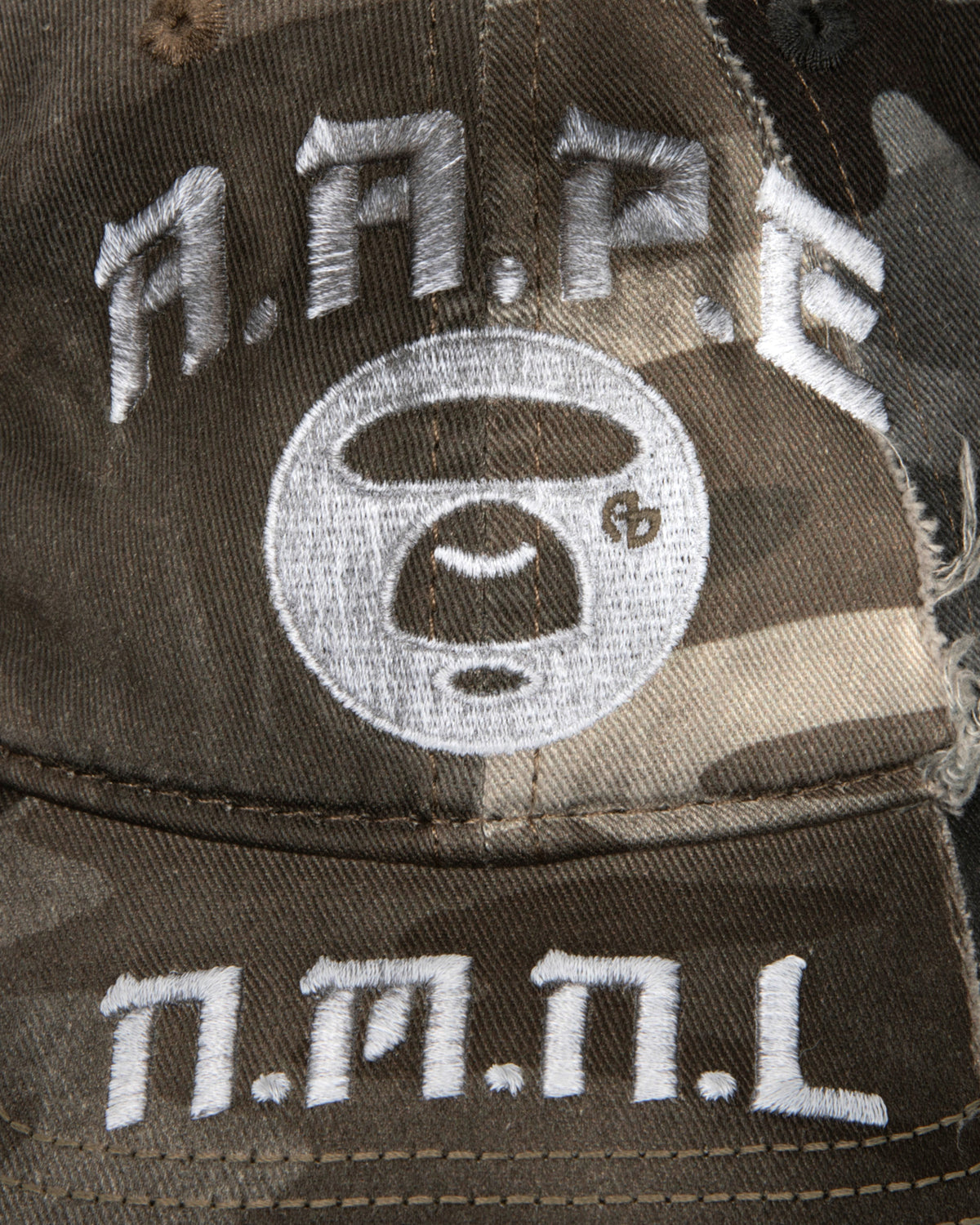 X NOMANUAL Moonface Crossover Cap
