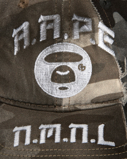 X NOMANUAL Moonface Crossover Cap