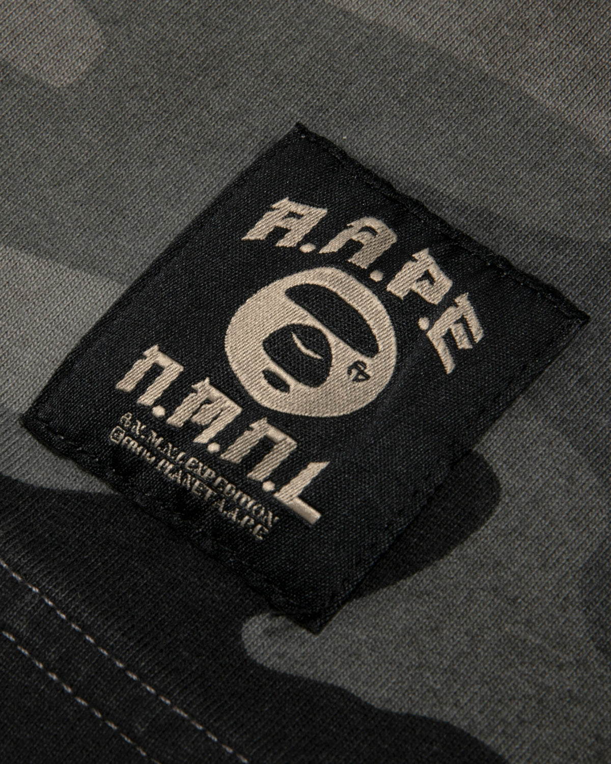 X NOMANUAL Moonface Crewneck Long Tee