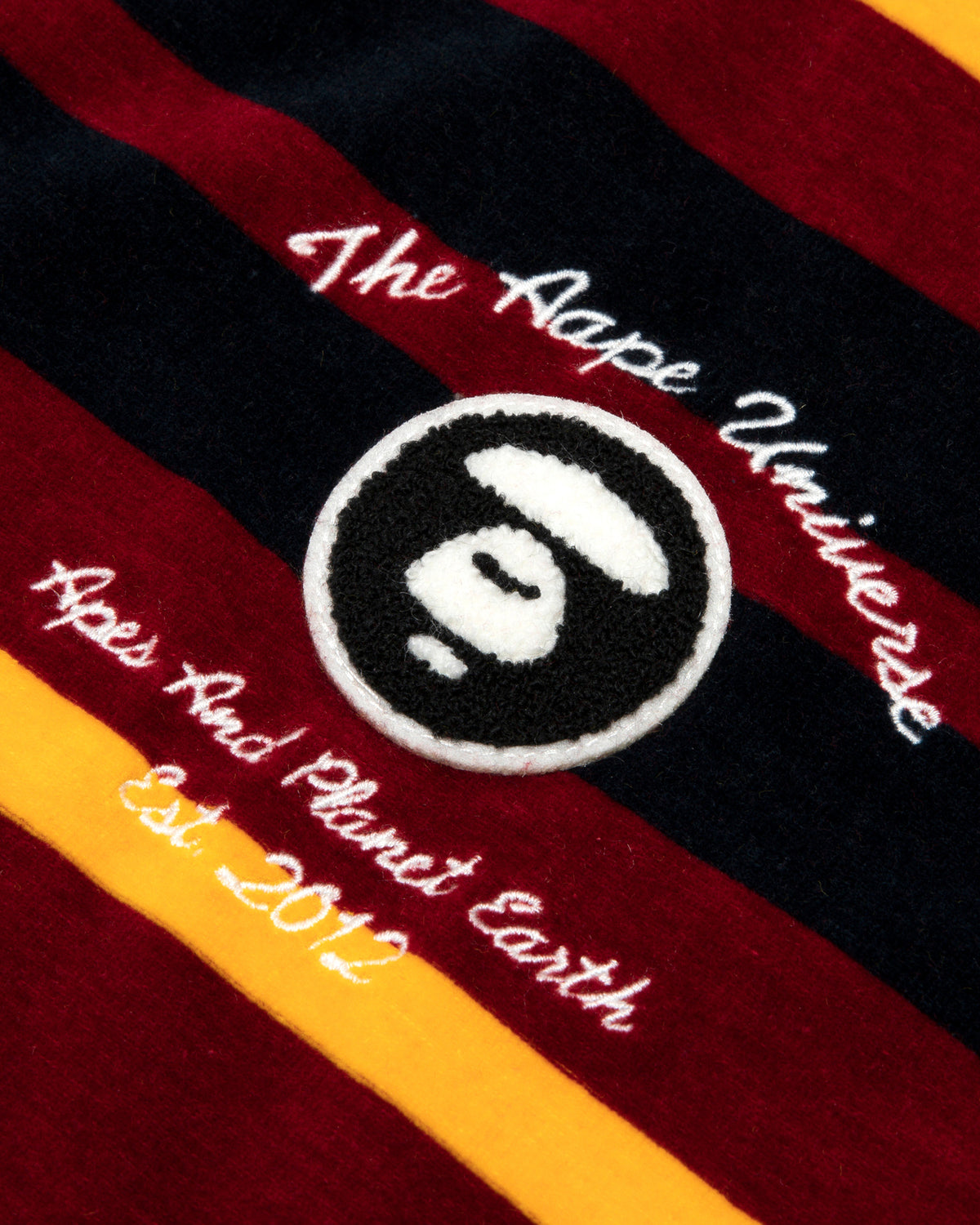 Moonface embroidered velour polo